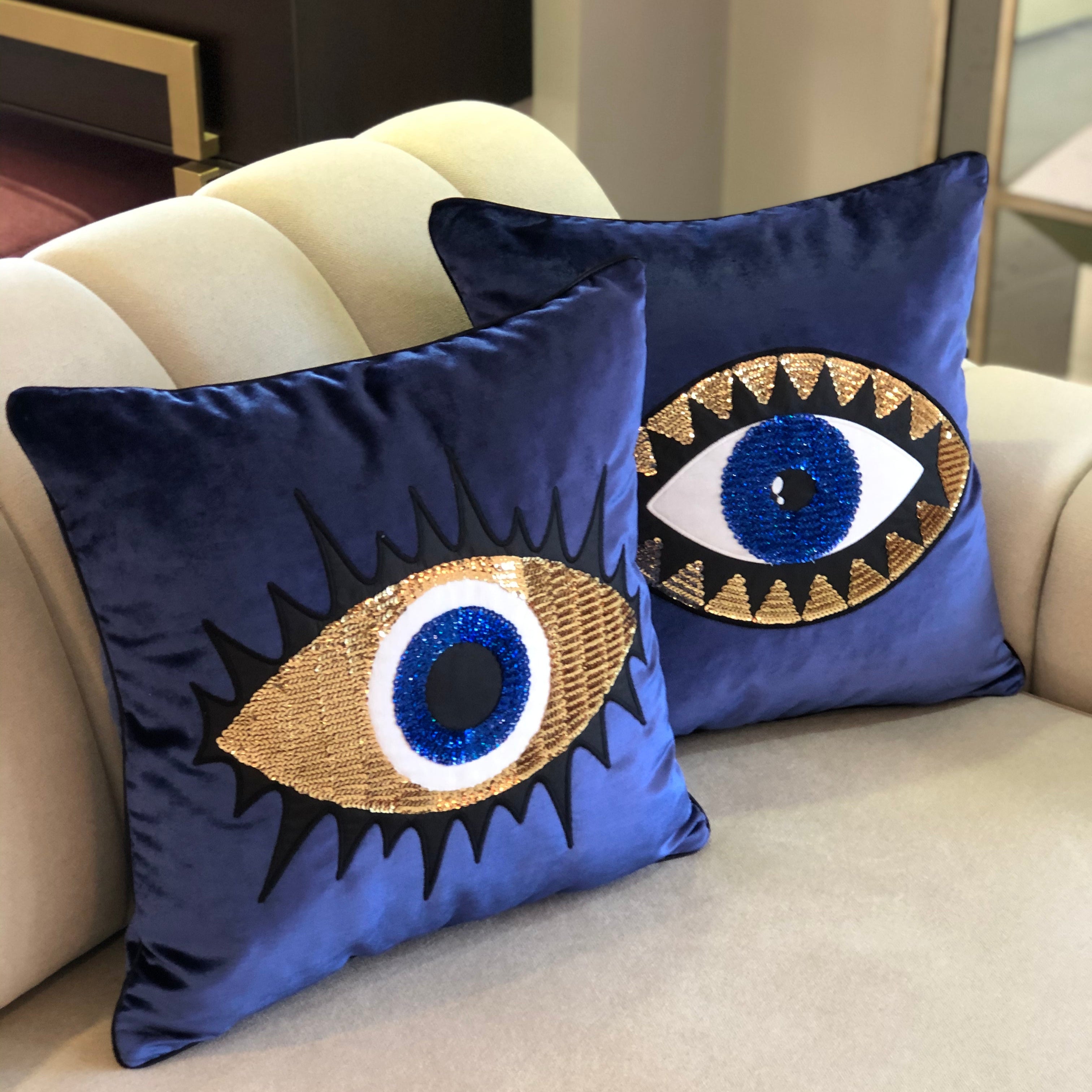 Luxurious midnight blue velvet pillow covers with elegant evil eye embroidery, perfect for adding style and protection to your home decor.